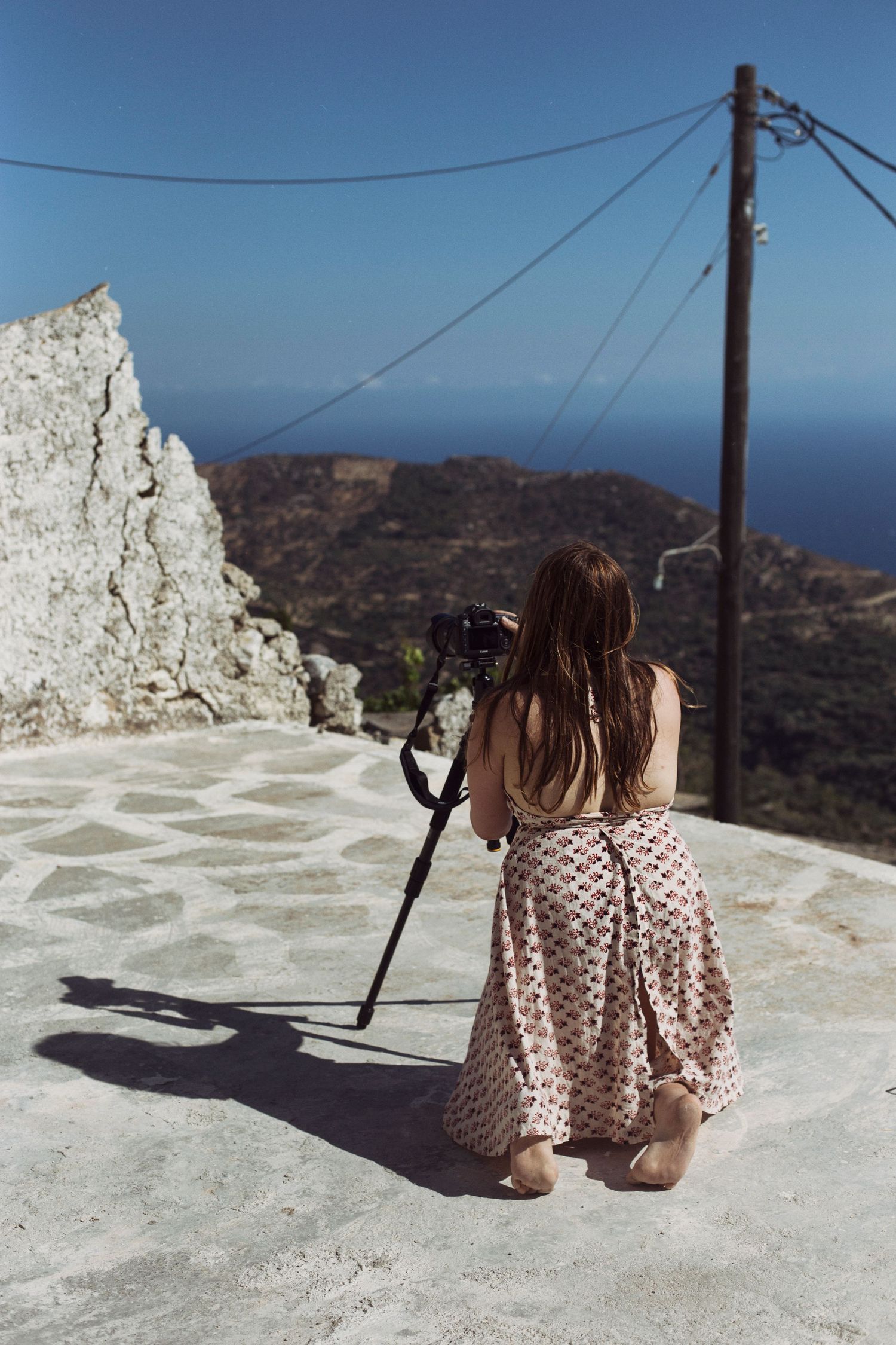 Photograph of a photographer taking a picture of the view in Crete, Greece
