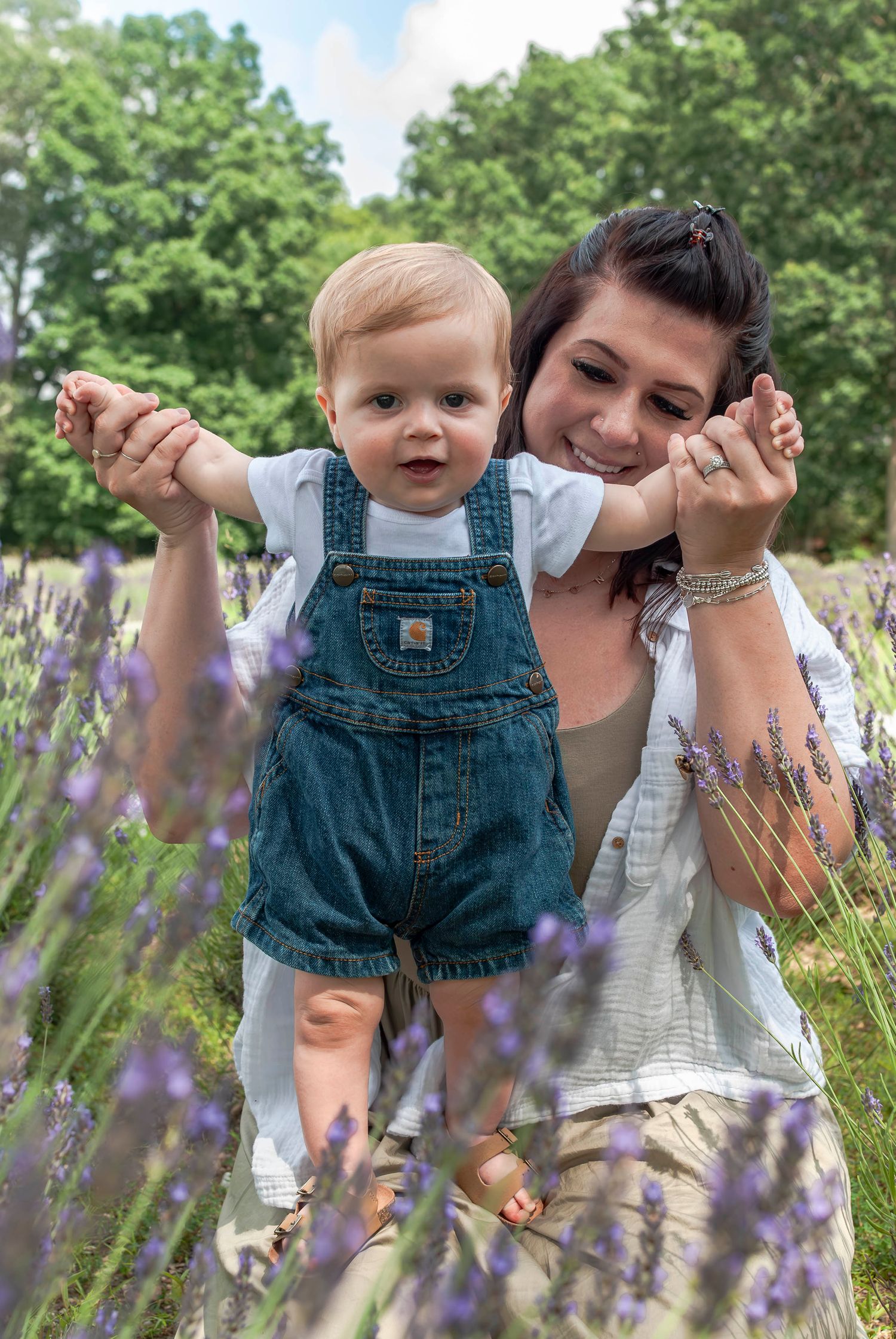 Family lifestyle portrait of mother and young child in a lavender field located in Connecticut
