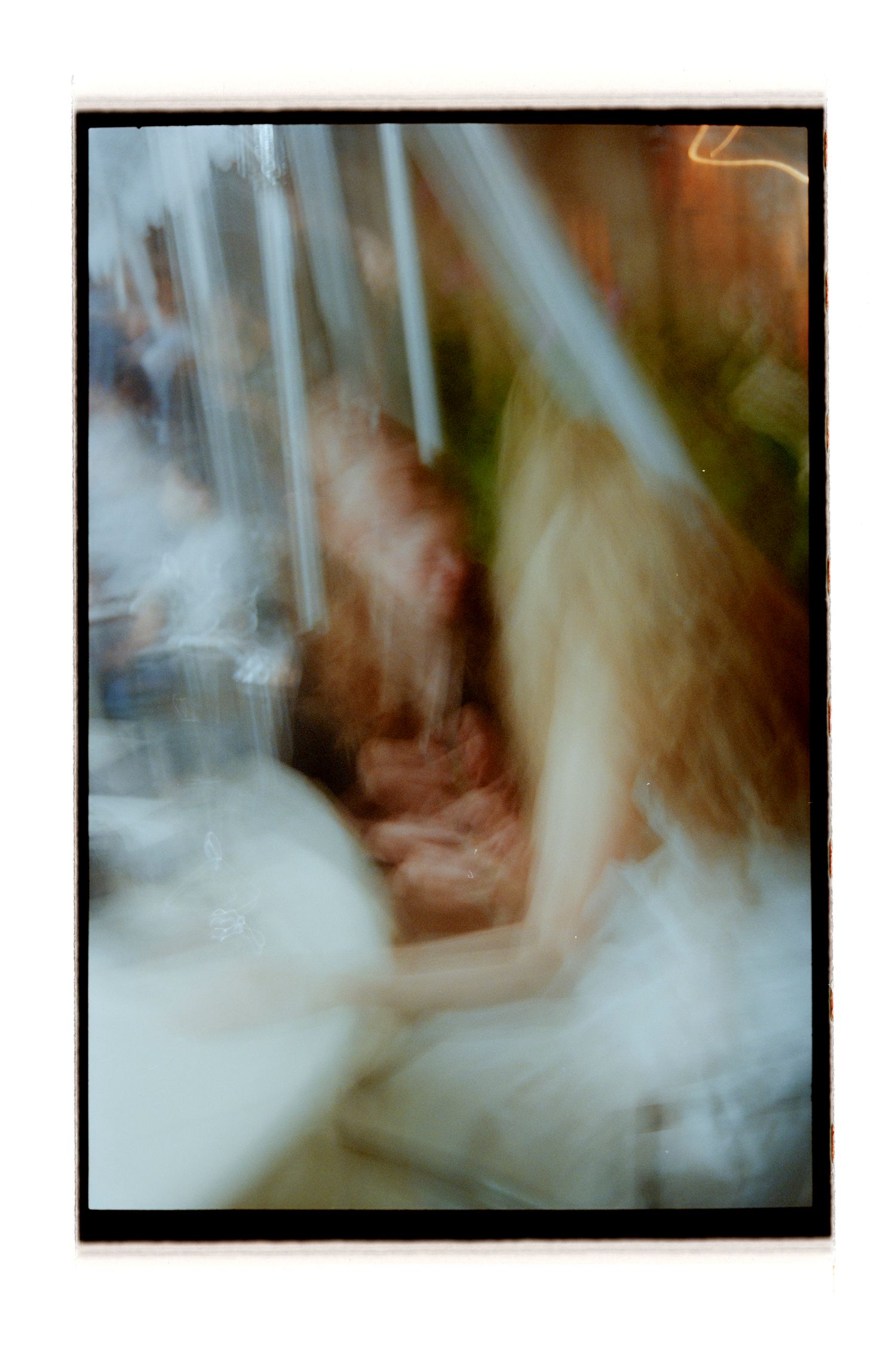 Abstract blurred motion photography creates an ethereal effect in muted tones. Rochester NY Film wedding photography