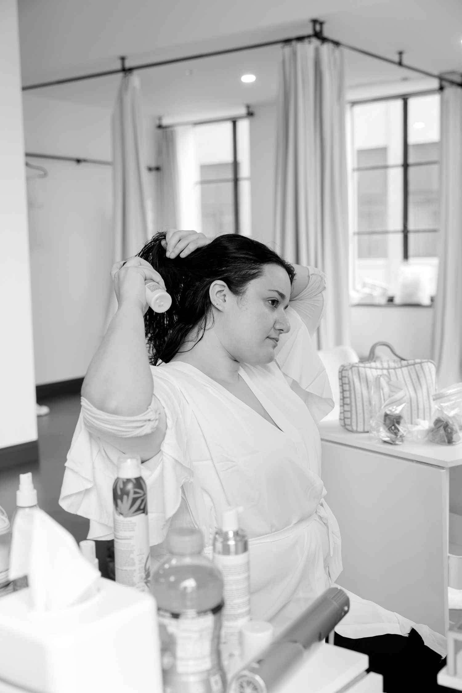 Wedding preparation scene with white dress and morning light.
