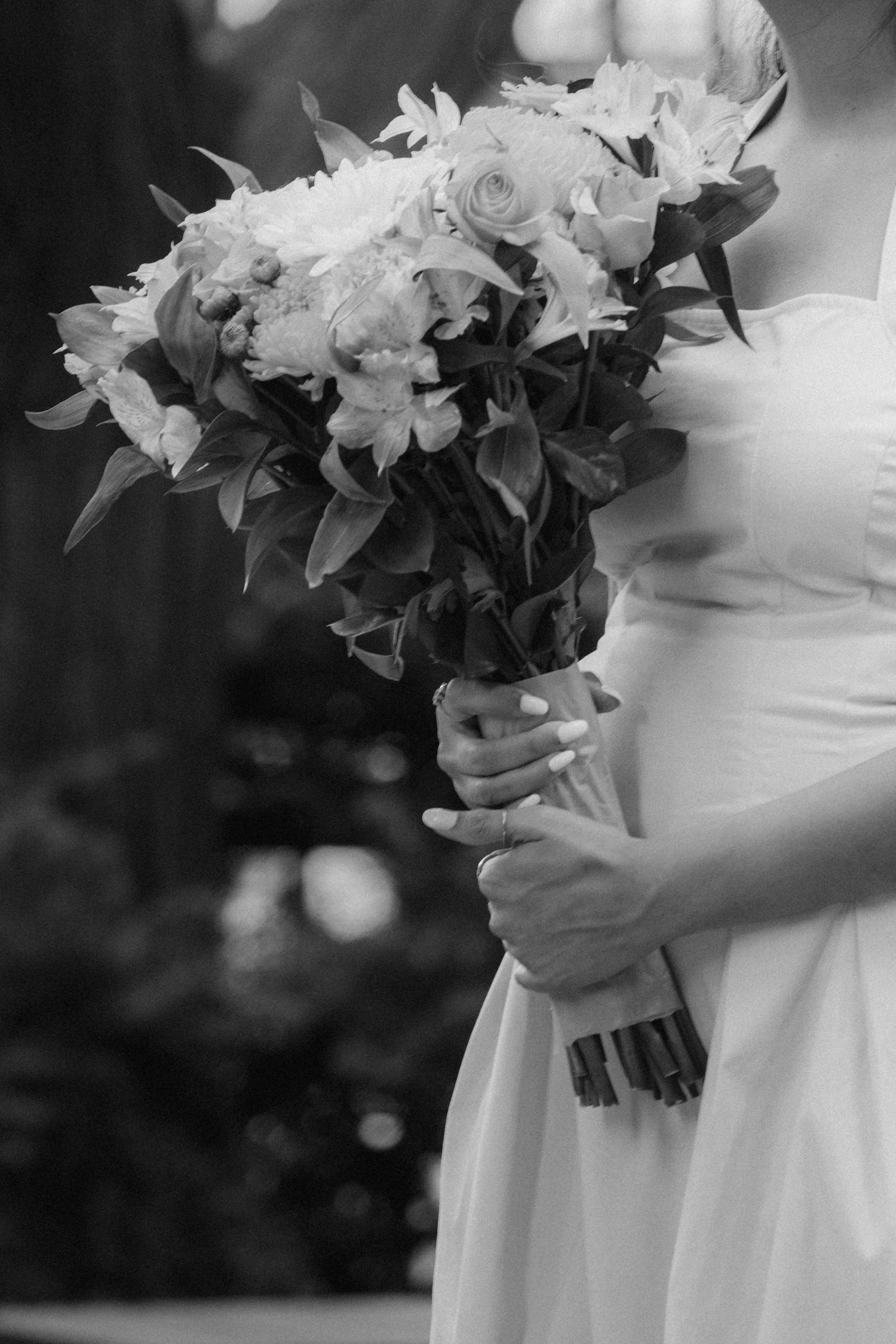 Black and white image of wedding bouquets with roses and mixed flowers.  St. Josephs park wedding photographer