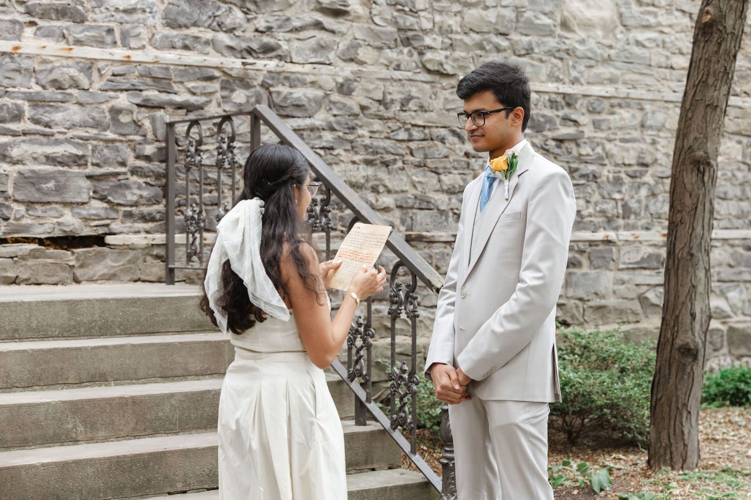 Wedding ceremony on stone steps with rustic wall background.  St. Josephs park wedding photographer