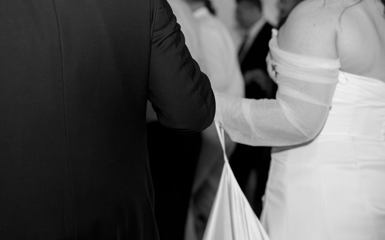 Wedding guests dancing and mingling at an elegant indoor reception. Arbor Midtown wedding photographer