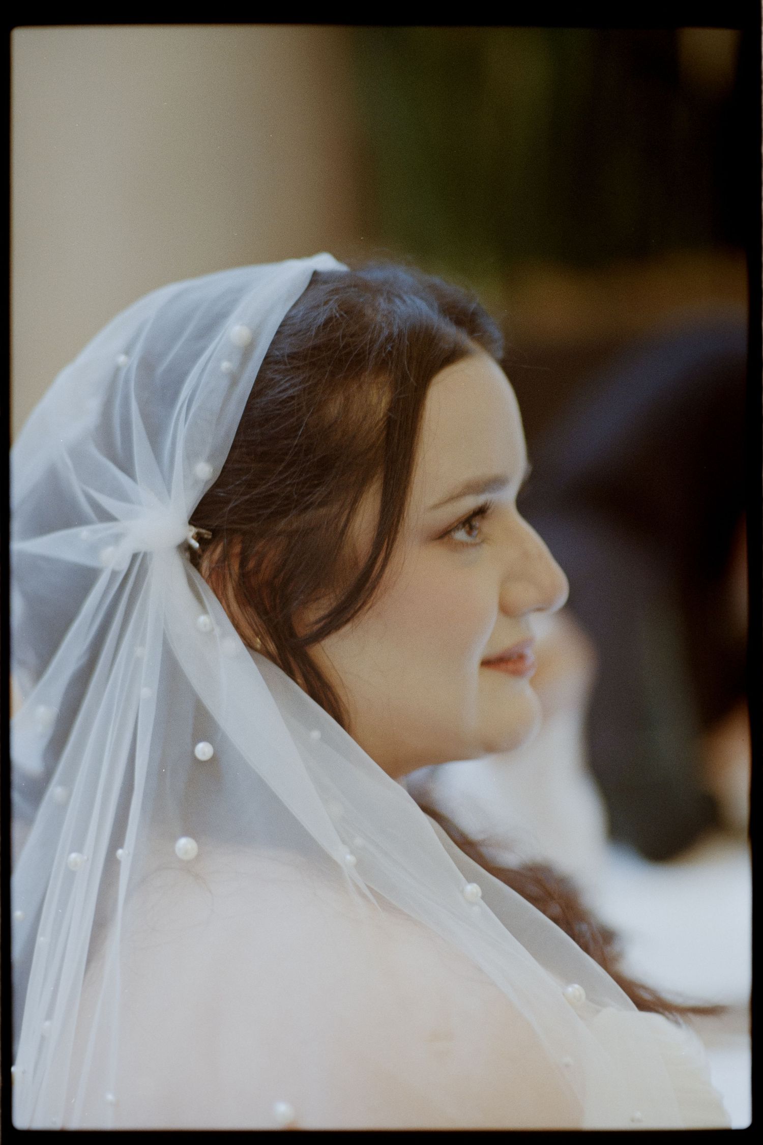 Ethereal profile shots of a bride wearing a delicate pearl-adorned veil. Arbor Midtown wedding photographer