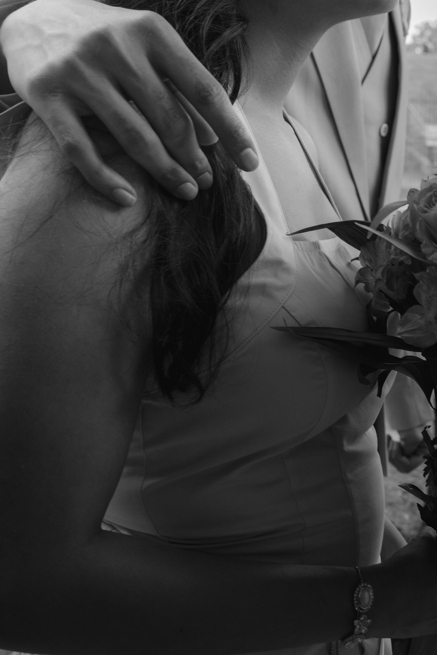Close-up black and white detail shots capturing tender moments between newlyweds.  Rochester conservatory wedding photographer