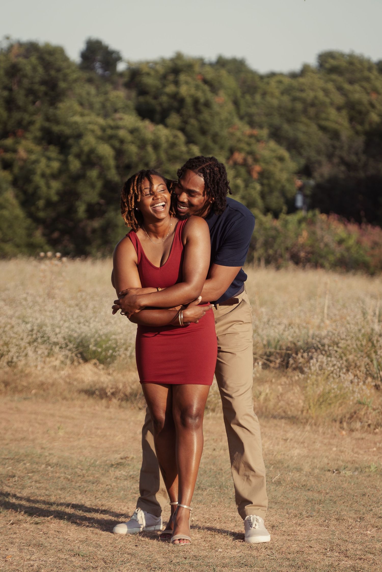 Black couple n red dress golden field engagement session Round Rock, Texas - vibrant romantic photography