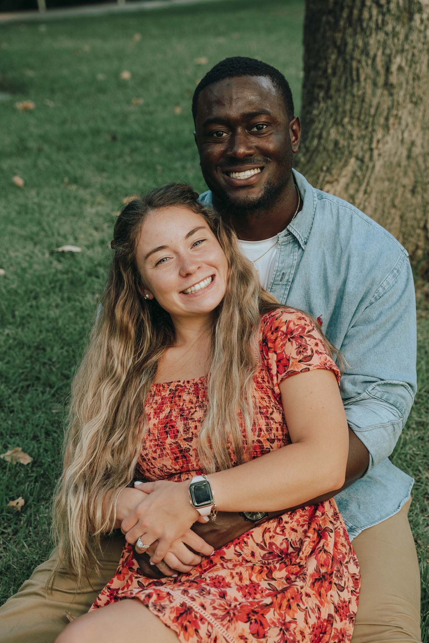 Happy interracial couple engagement session Austin park - natural outdoor couple photography