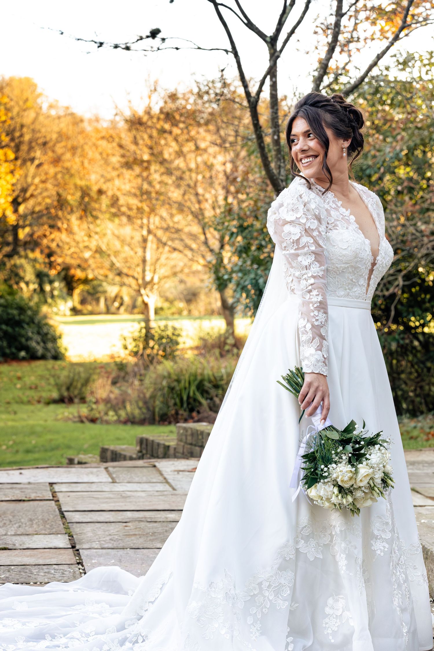 Bride during posed photoshoot on her wedding day from side profile