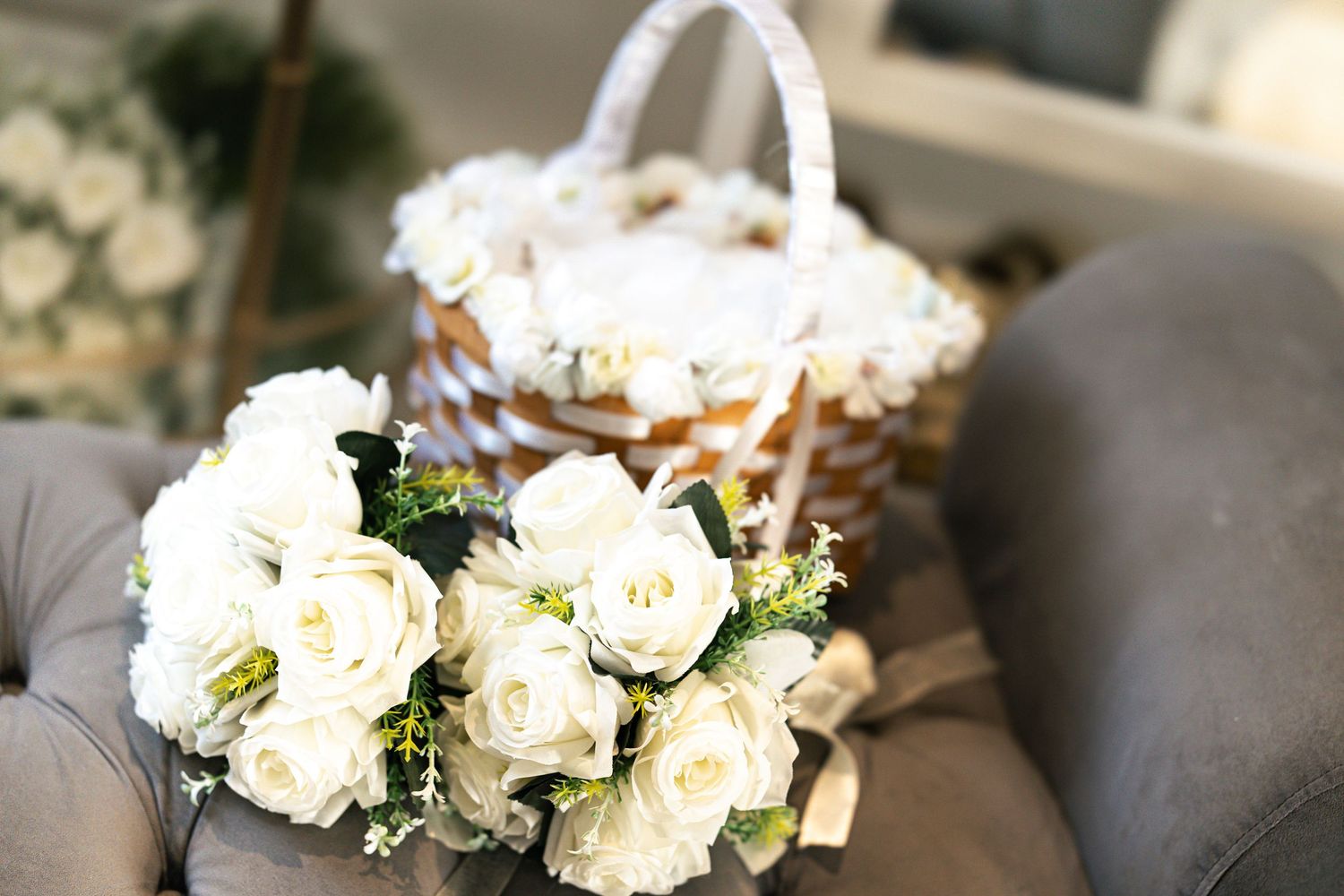 Flower girl basket and wedding bouquet of white roses