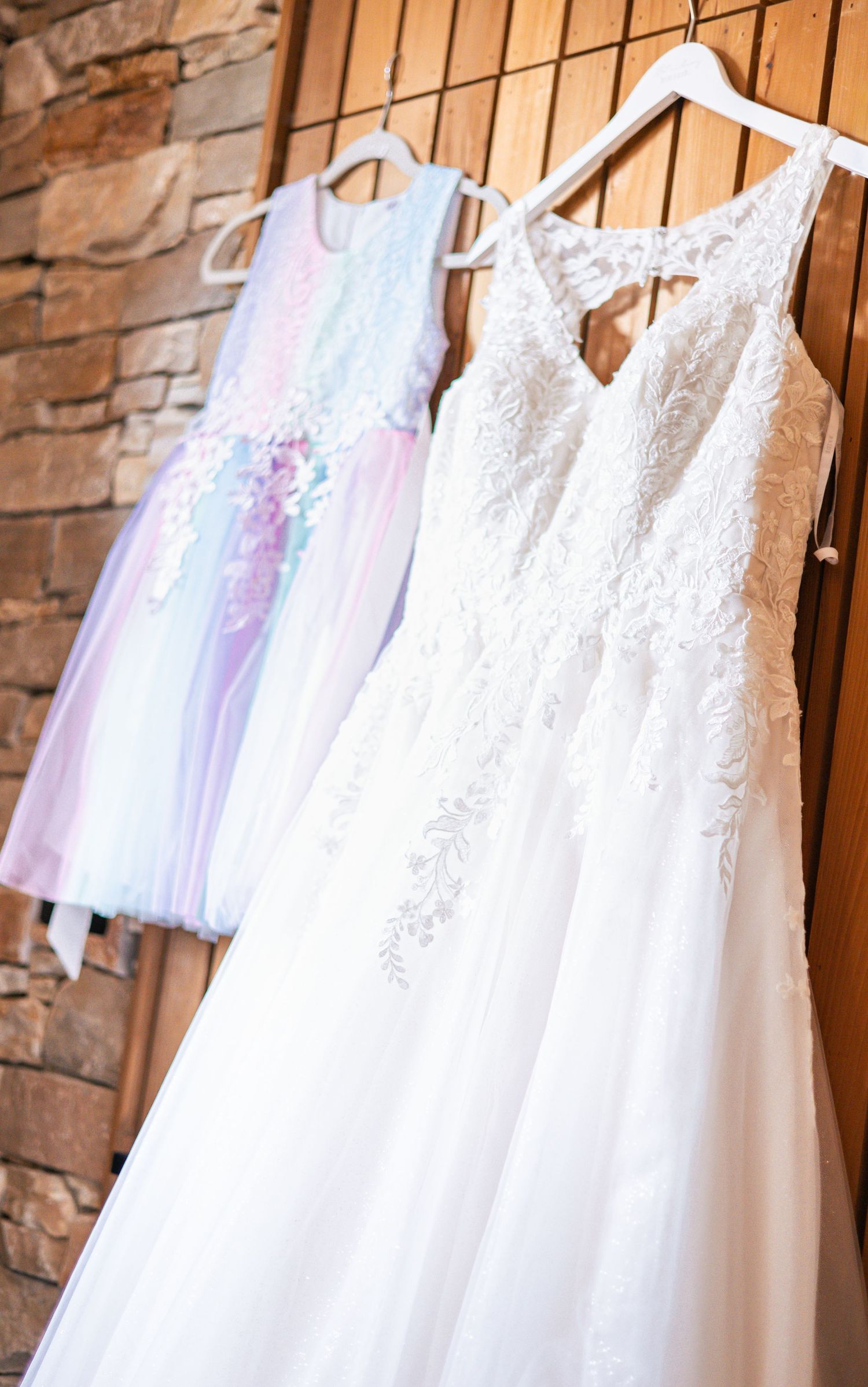 Wedding dress and Flower girl dresses hanging up