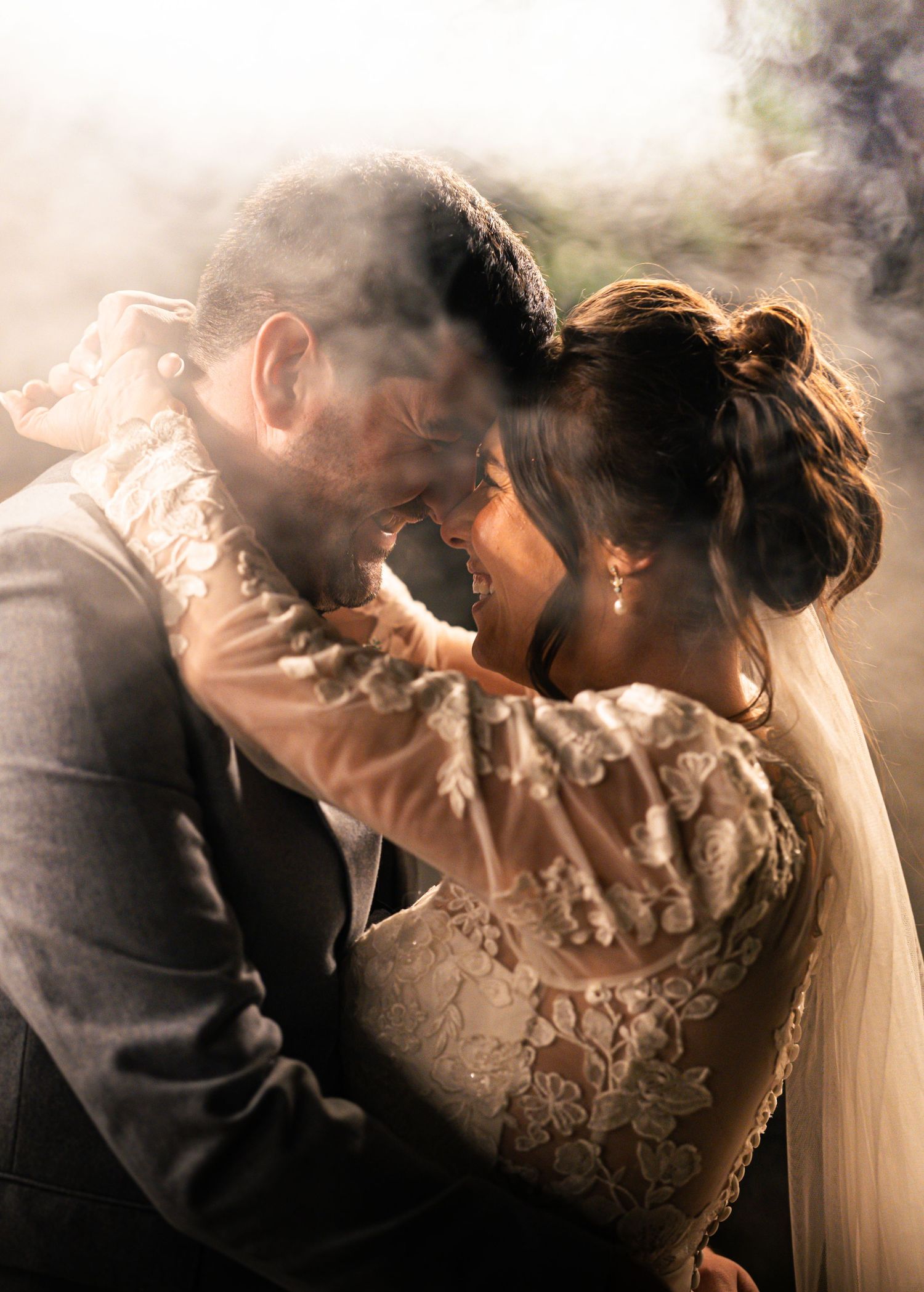 Newly married couple in candid moment with a smoke effect night theme