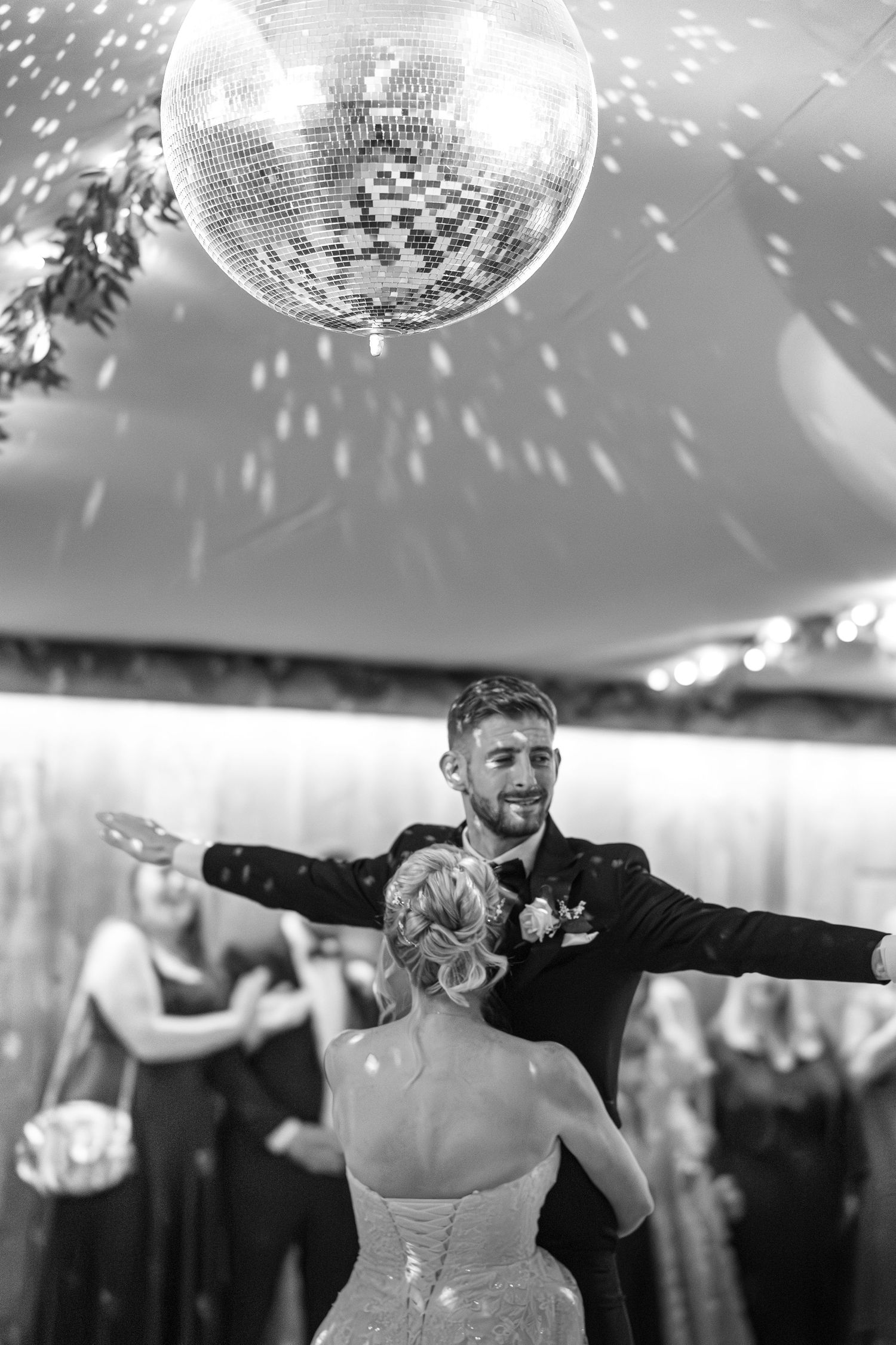 Unexpected moment of bride picking up the groom during their first dance