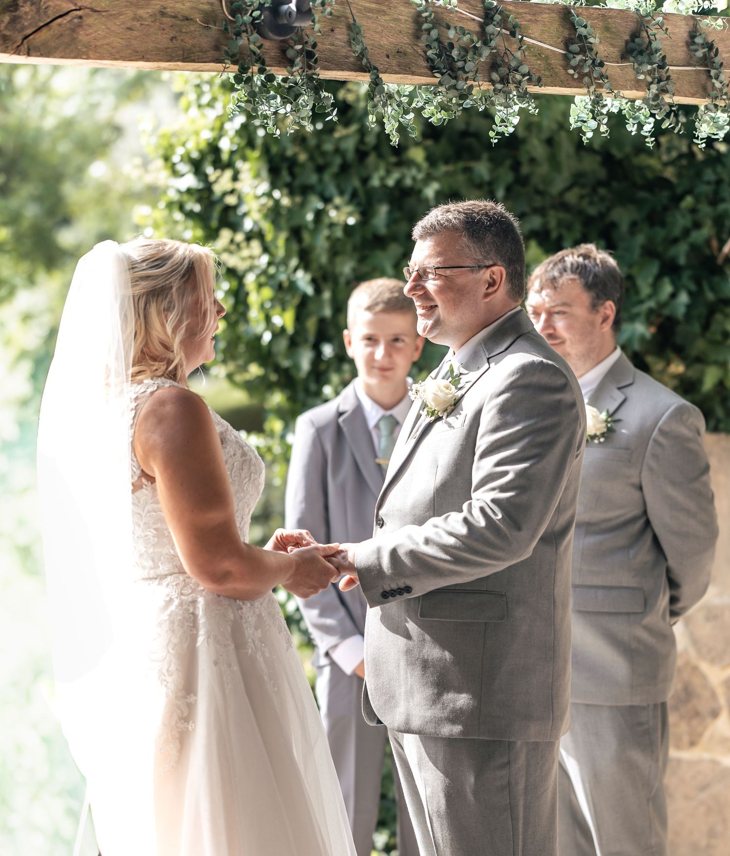 Ceremony moment of Bride and Groom holding hands