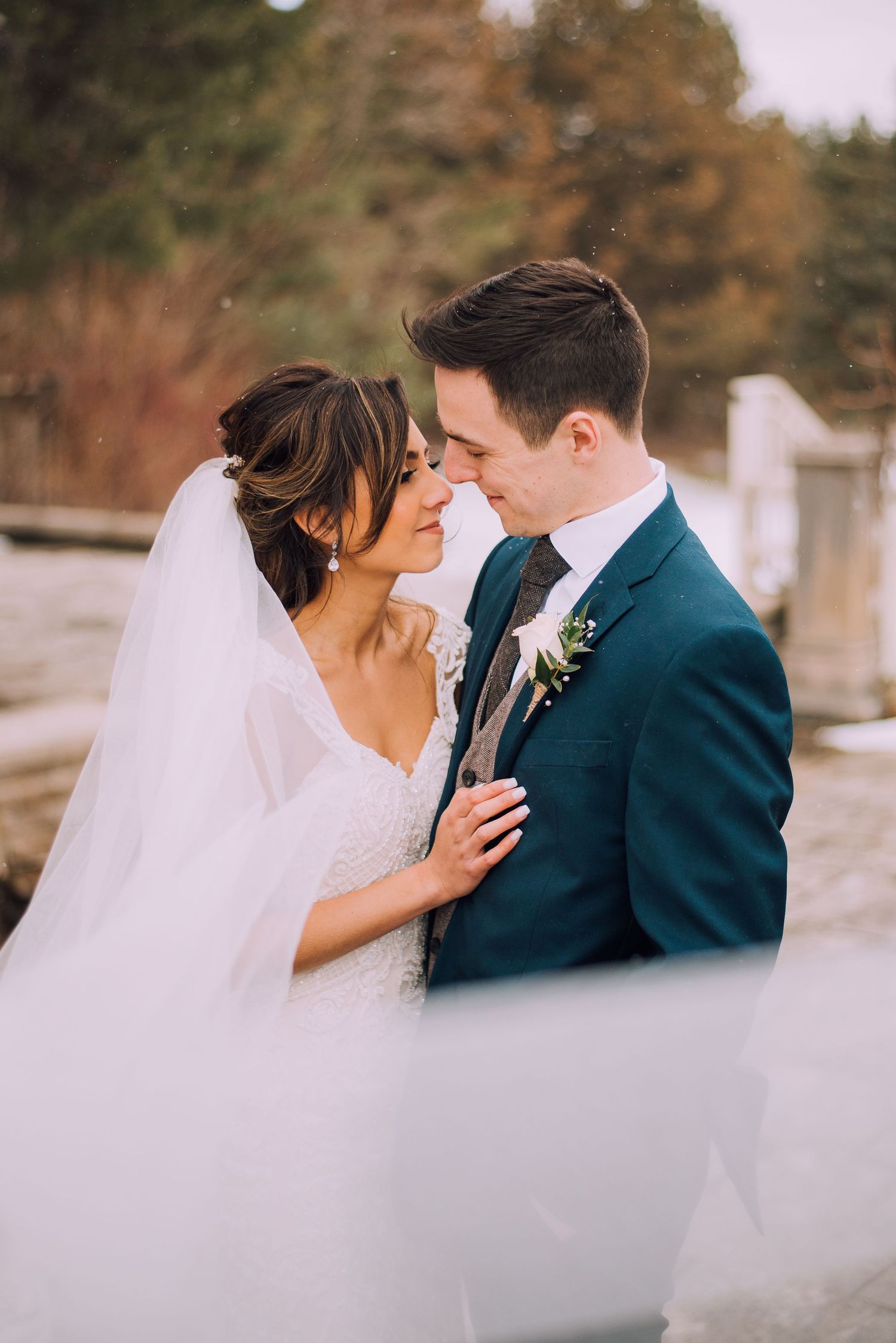 A bride and groom embracing