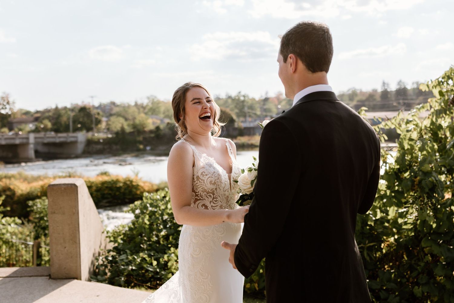 Candid wedding moments captured in golden sunlight on an outdoor terrace.