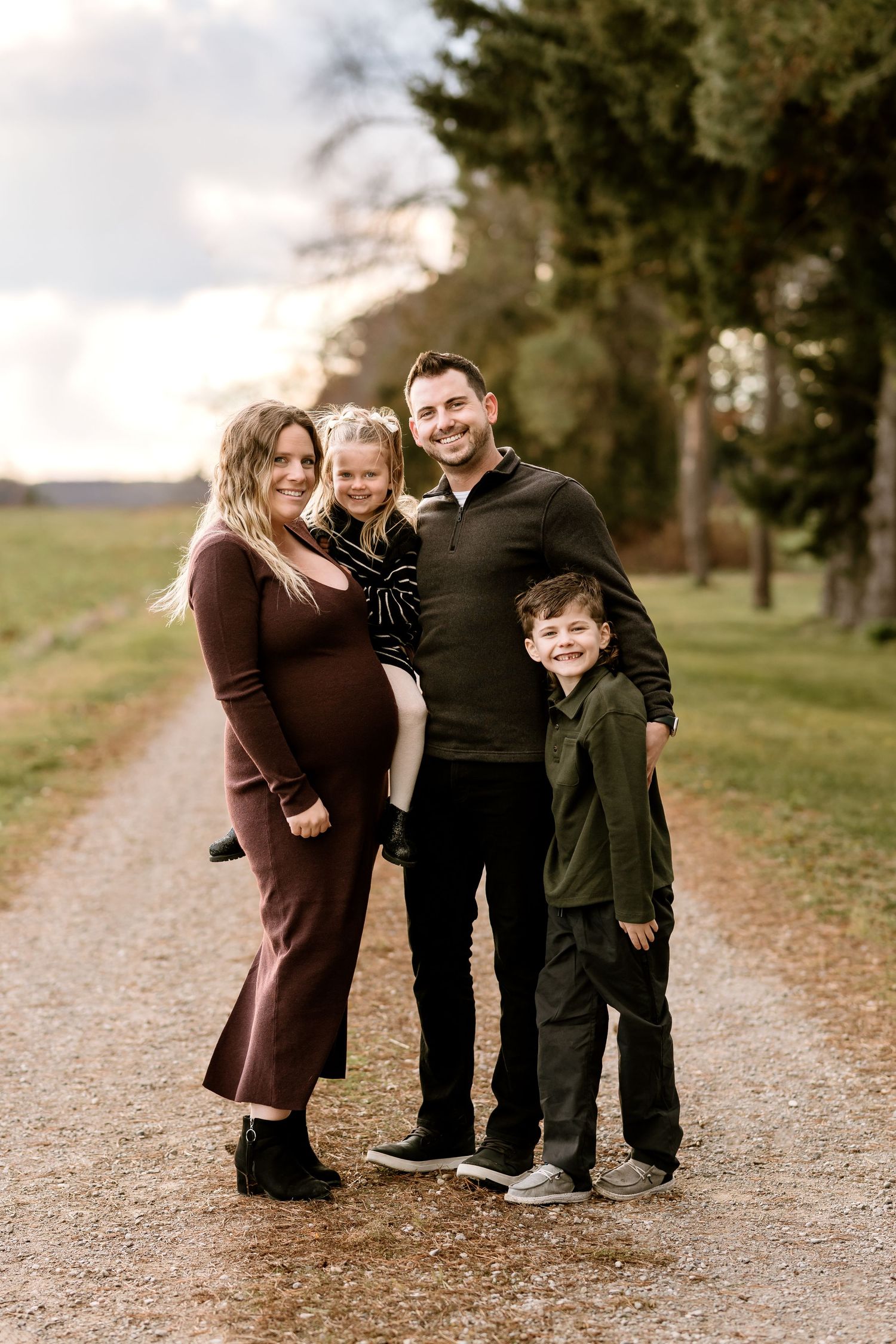 Candid family moments captured on a scenic outdoor trail.