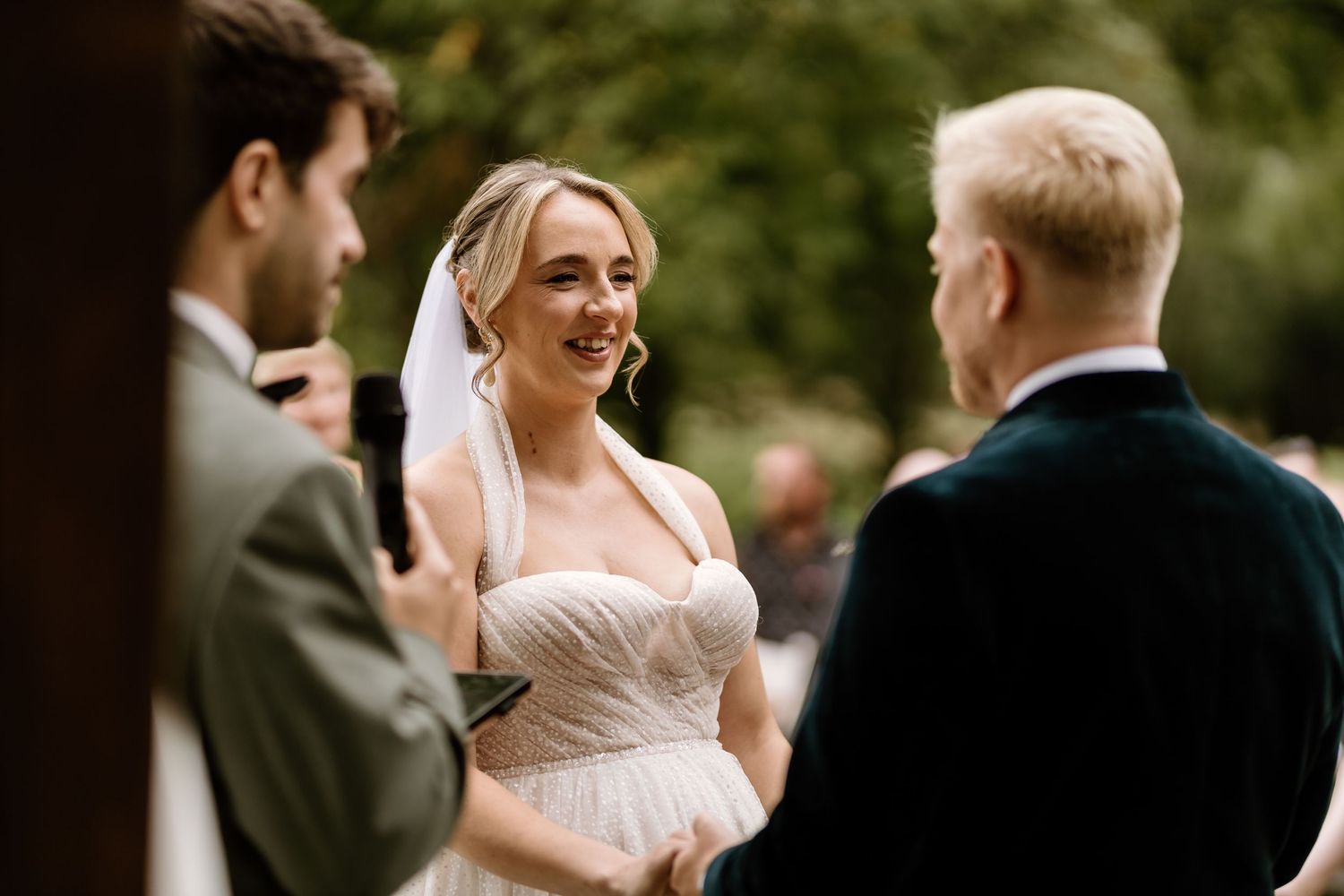 Emotional wedding ceremony moments captured in outdoor setting.