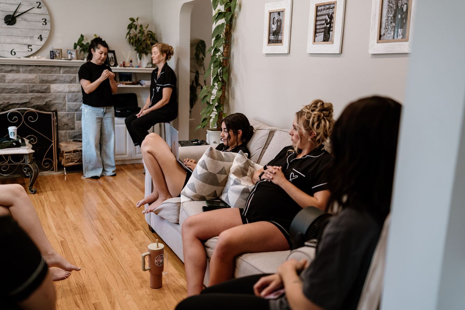 Wedding preparations in a bright indoor space with people getting ready.