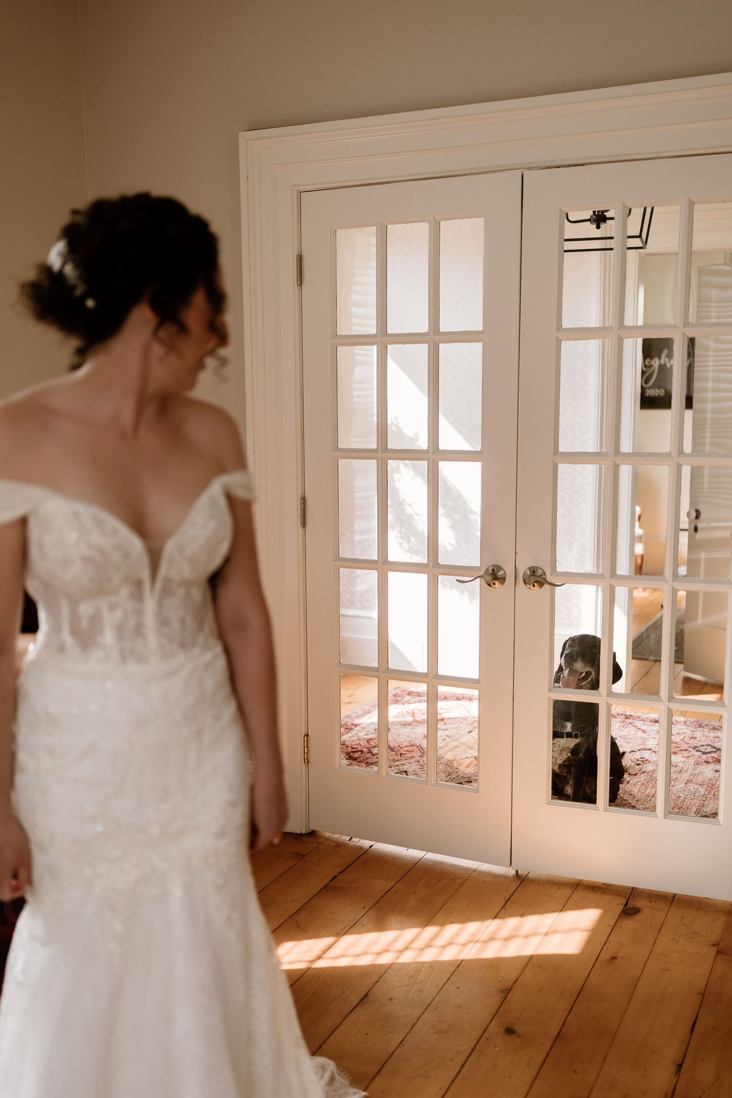 Elegant white wedding dress with lace details photographed in natural light.