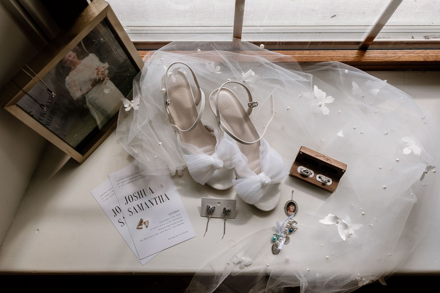 Wedding day details and accessories arranged in an artistic flat lay composition.