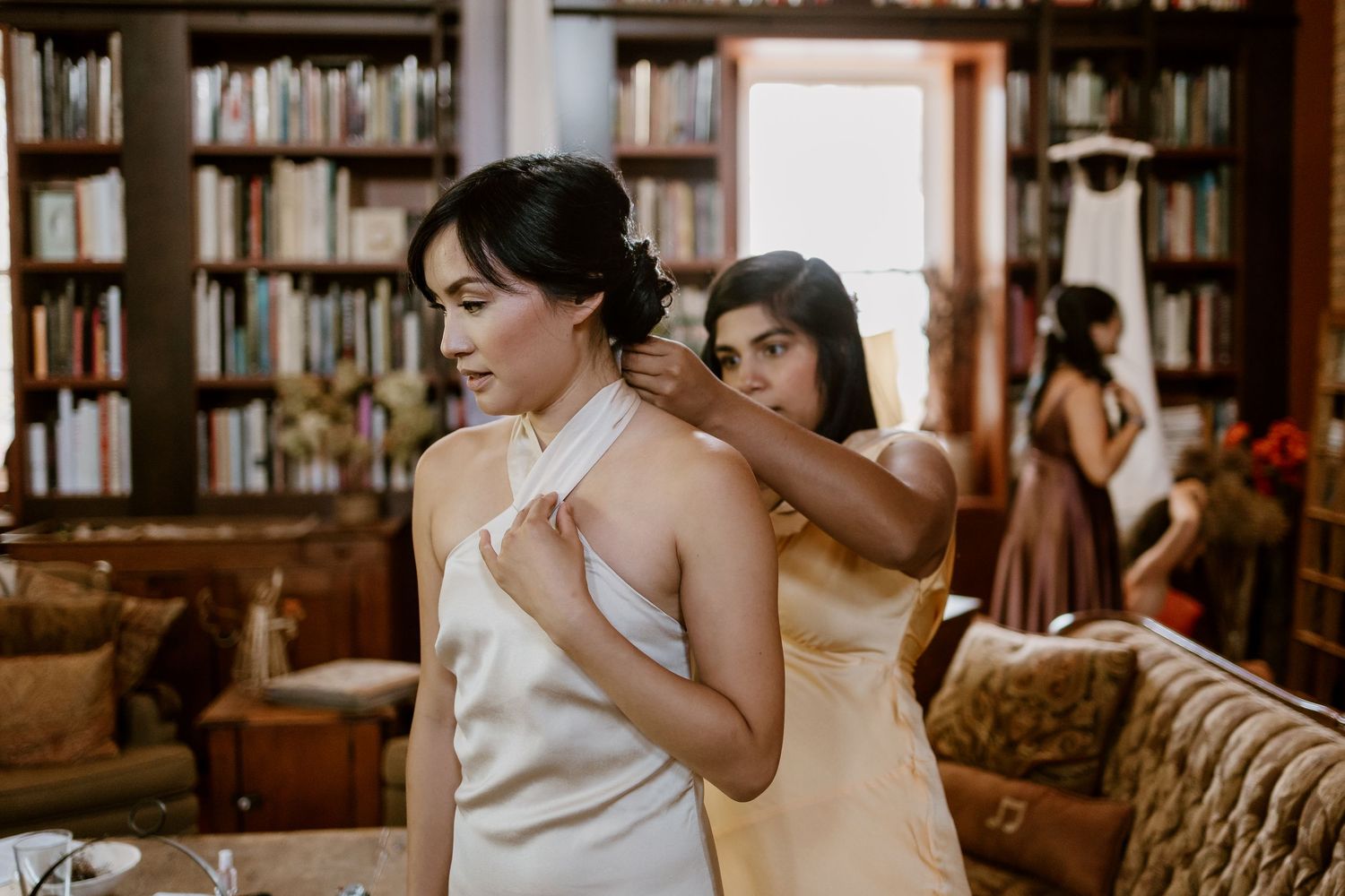 Elegant indoor photo session with vintage furniture and natural lighting.