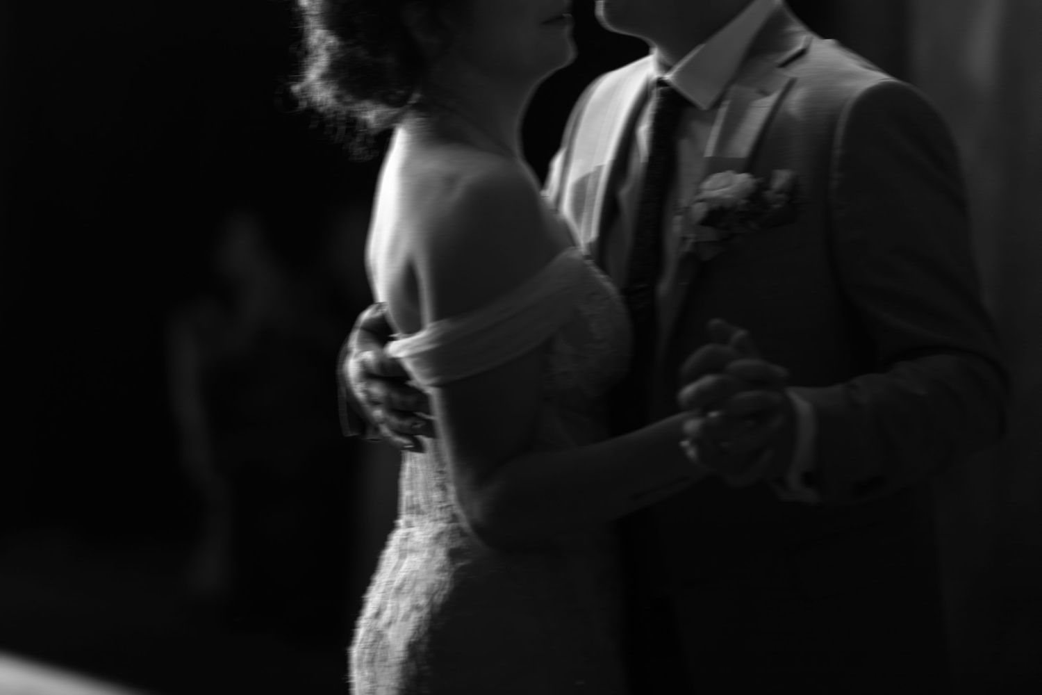 Intimate black and white photo of a couple's first dance.