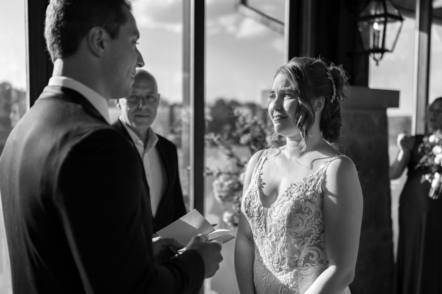 Black and white wedding ceremony photos showing emotional moments between the couple.