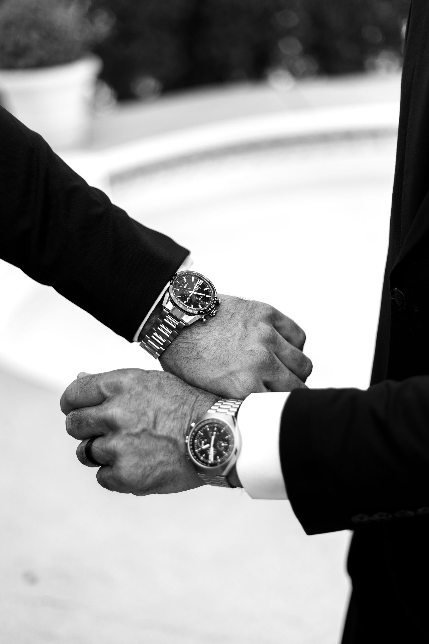 Close-up shots of hands wearing watches in formal attire.