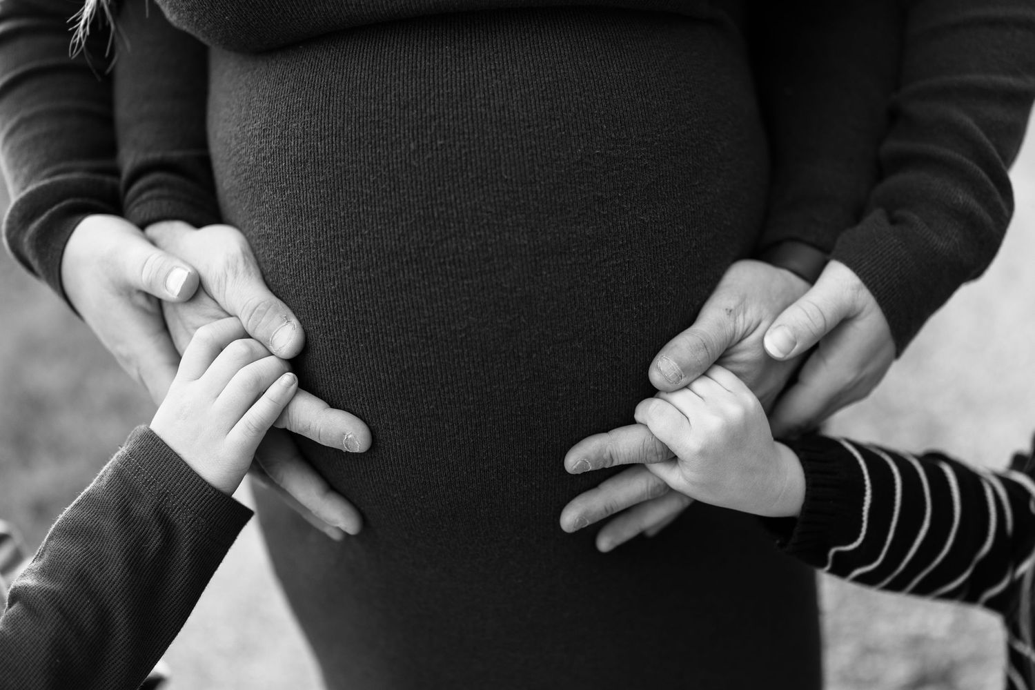 Close-up detail shots of hands and clothing in black and white.