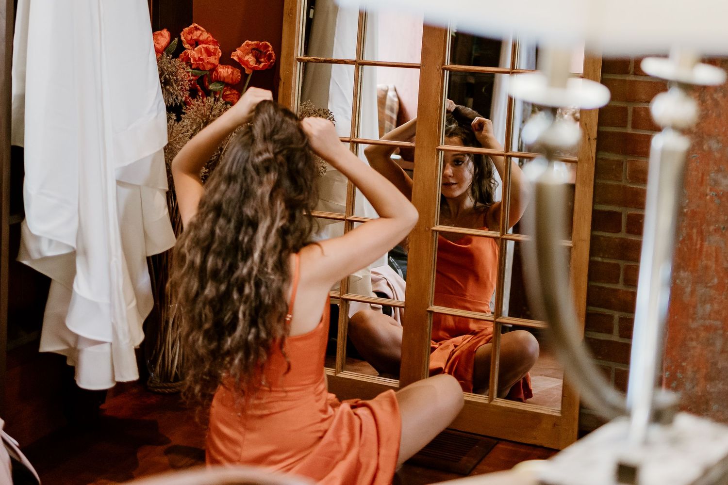 Warm-toned photography session in a classic library setting.