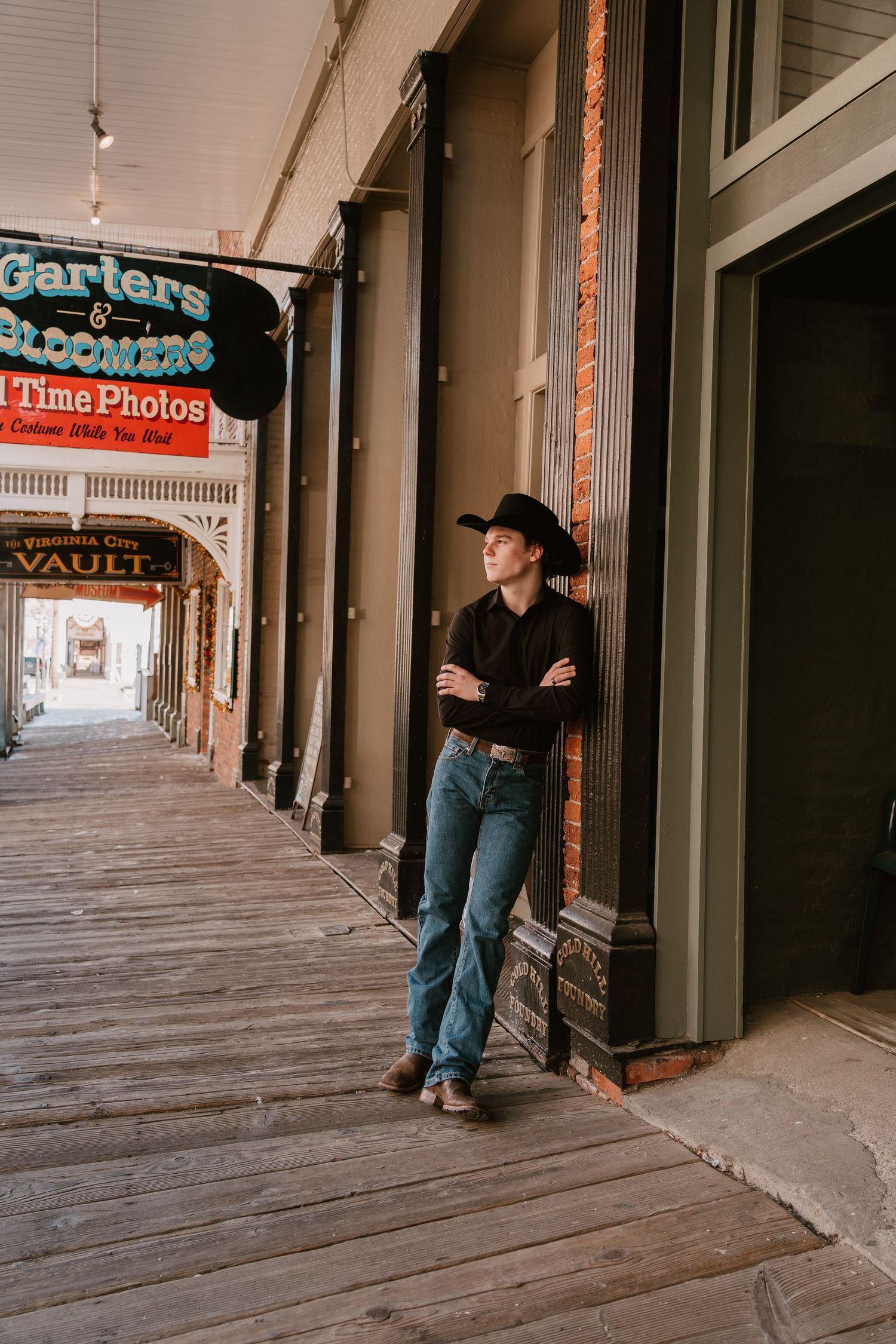 Vintage wooden boardwalk with old storefronts and rustic signage.