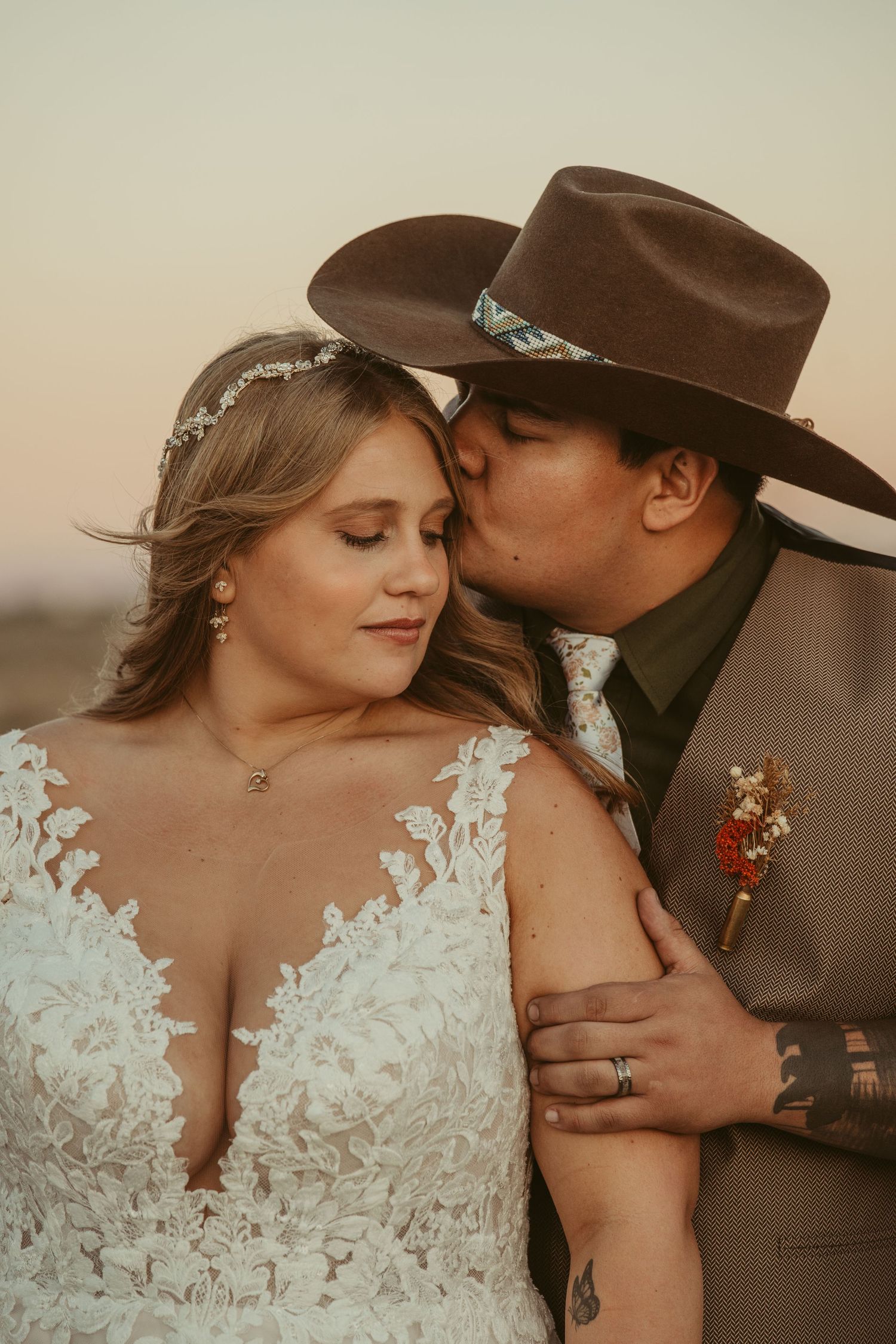 A romantic couple in western attire shares intimate moments at sunset in a series of connected photographs.