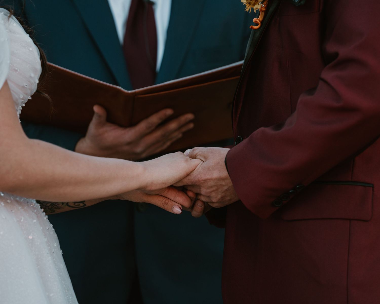 Reno, Nevada wedding ceremony with couple exchanging rings.