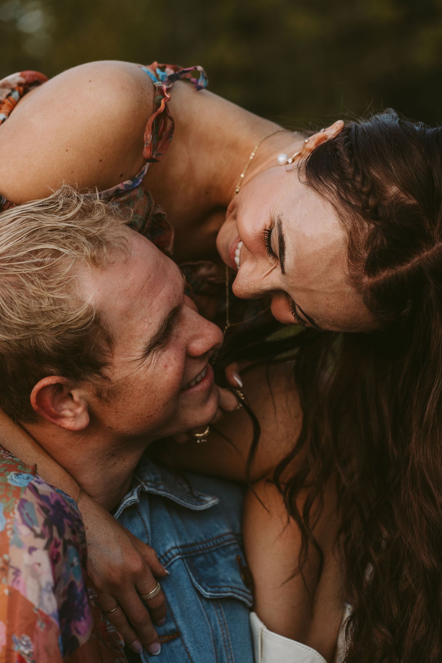 A romantic couple sharing intimate moments in a series of close-up photos against a natural background.
