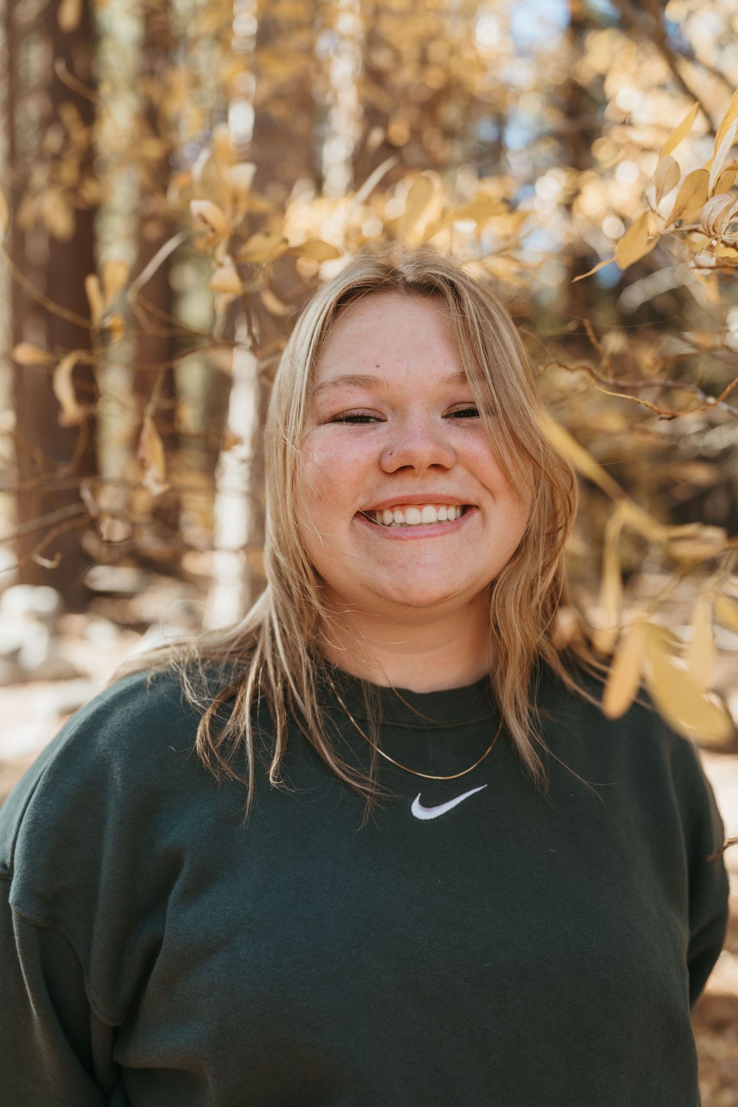 A series of candid outdoor portraits showing joyful expressions and blonde hair against a warm autumn background.
