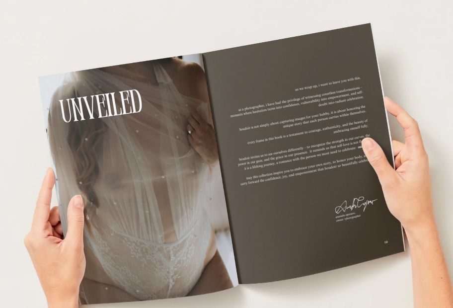Hands holding open a bridal magazine titled Unveiled with elegant dark brown pages and wedding veil photography.