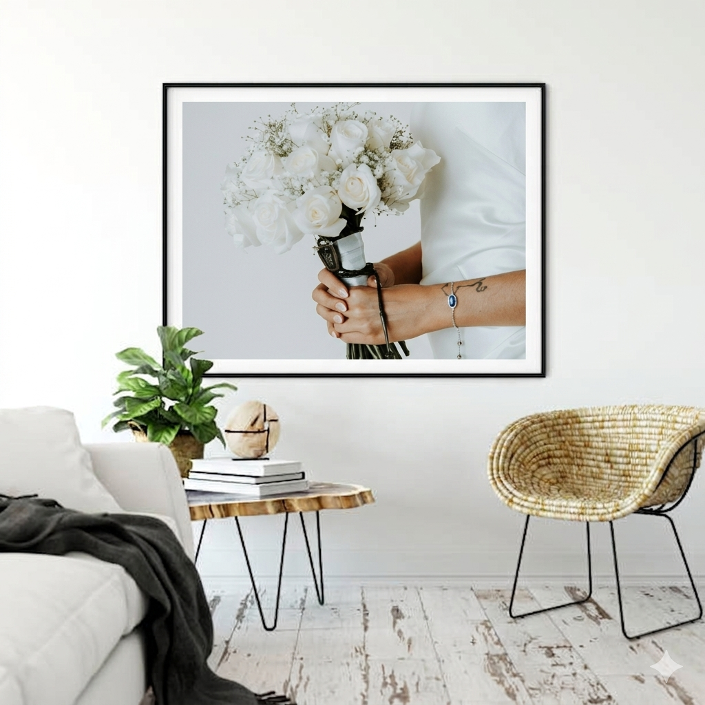 Person holding white flower bouquet with tattoo bracelet, framed wall art in bright Scandinavian living room.