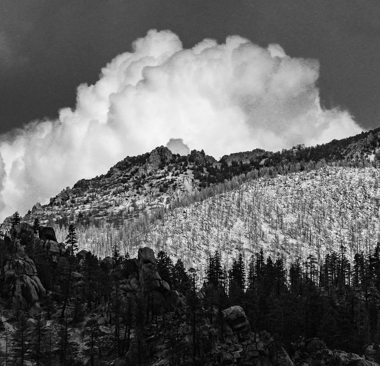 black and white image of clouds over the sierras in south lake tahoe