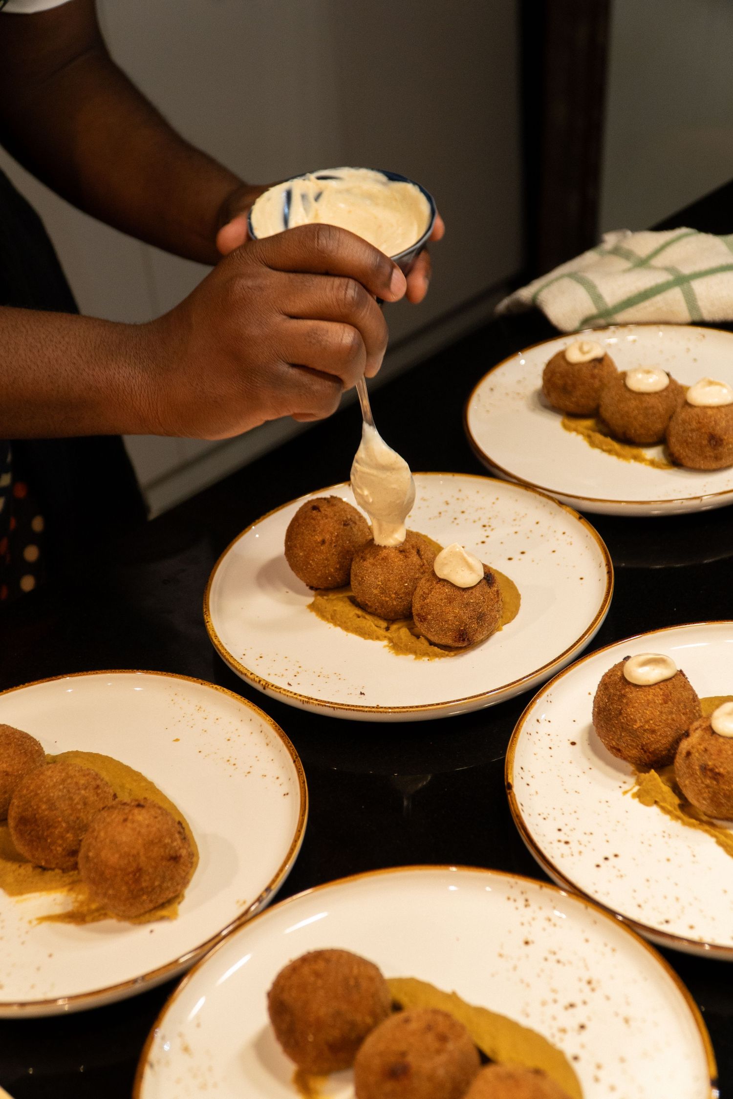 Chef Niyi Brown photographed during an Afro-fusion tasting by Wisely's Mind.