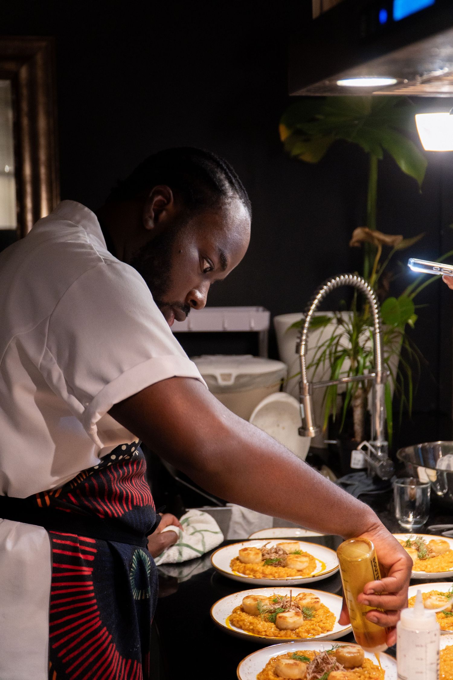 Chef Niyi Brown photographed during an Afro-fusion tasting by Wisely's Mind.