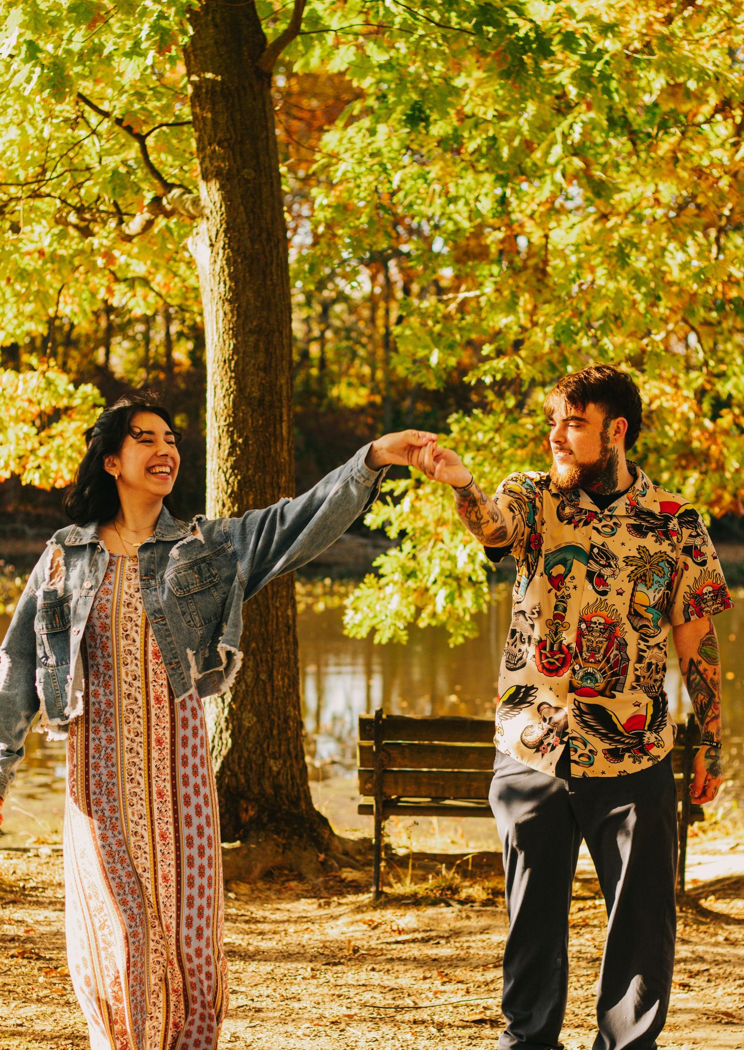 Playful autumn photoshoot sequence showing a couple dancing and laughing under golden trees.