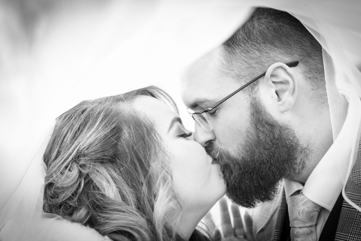 Romantic black and white close-up of tender wedding moment.