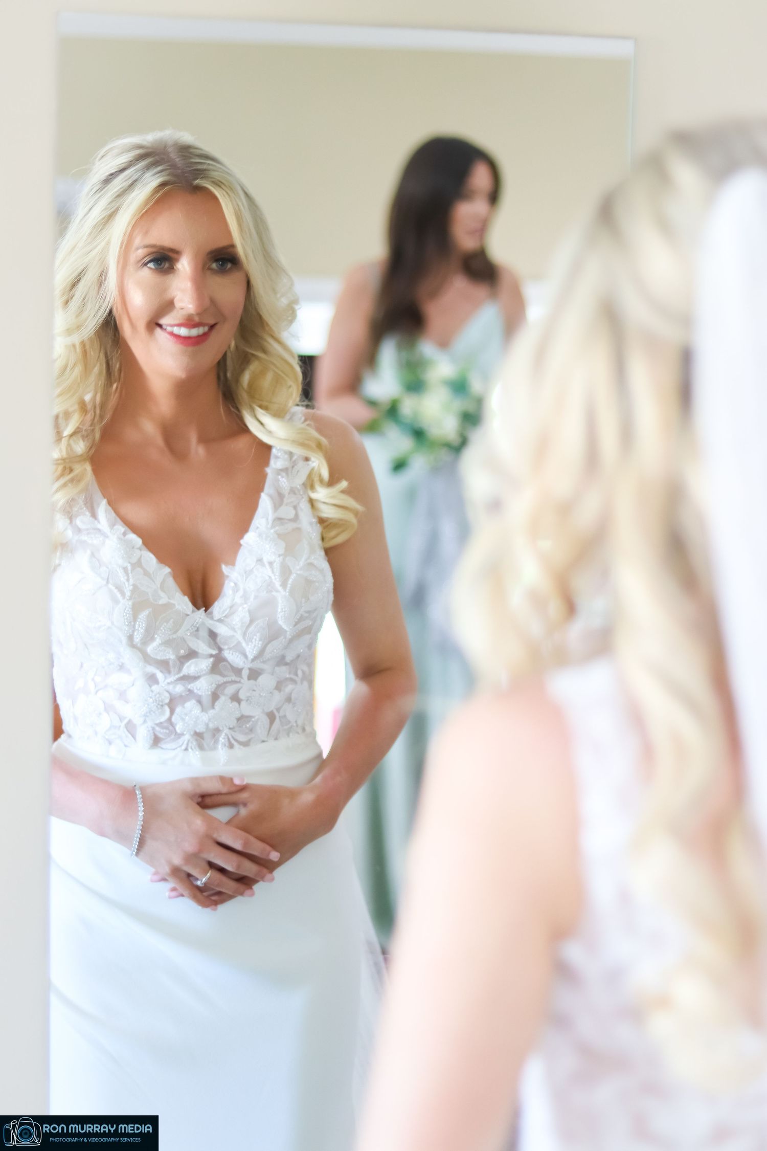 Close-up shots of a bride in an elegant white lace wedding dress with delicate details.