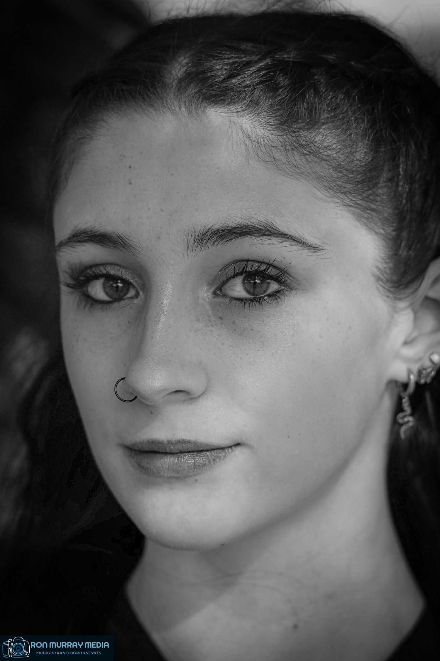 Black and white portrait series showing close-up facial expressions with dramatic lighting.