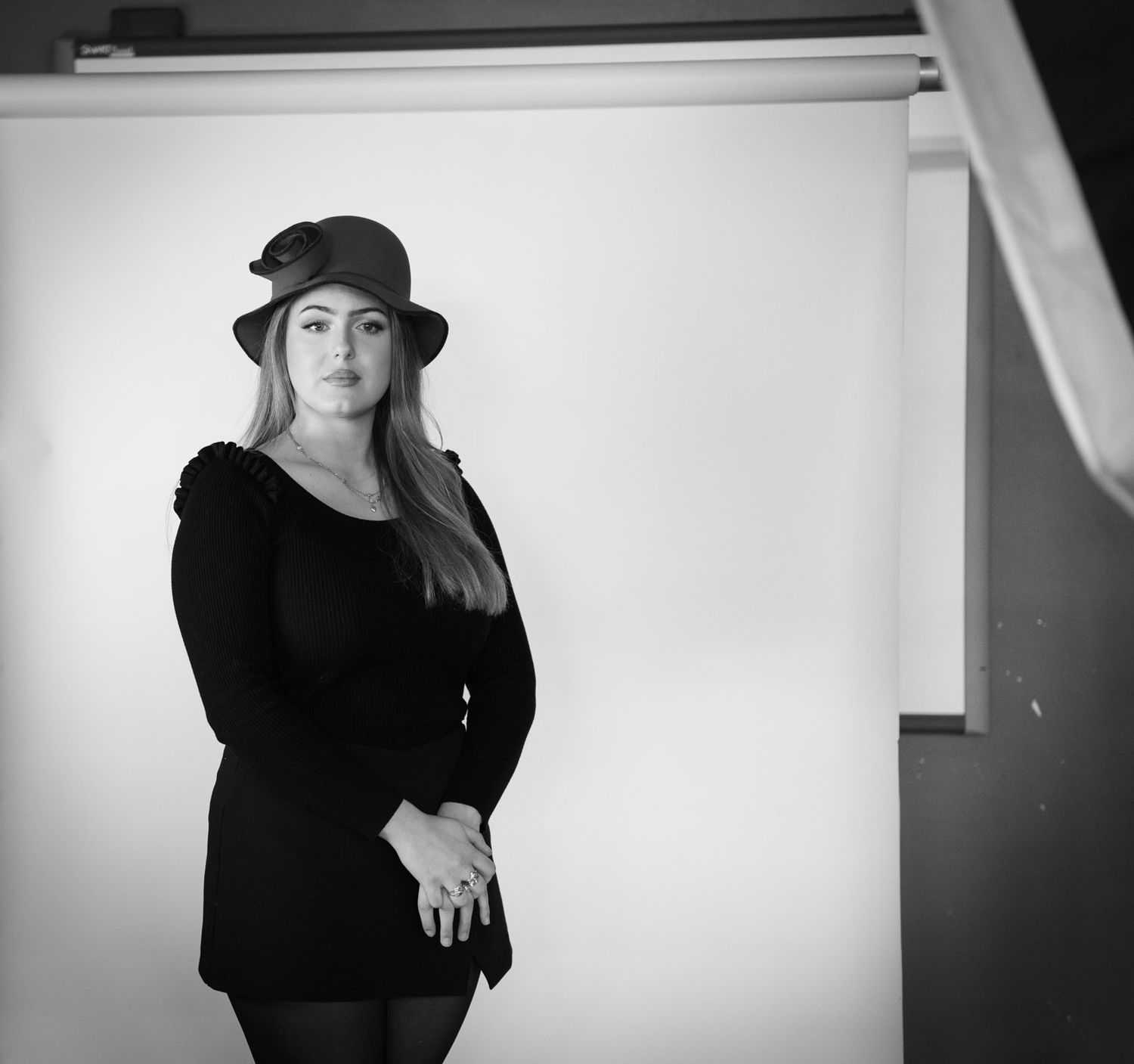 Behind the scenes of a female portrait with studio lighting.