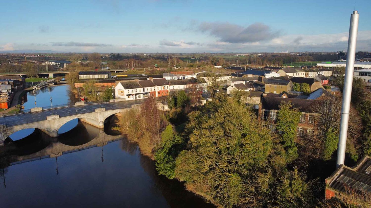 Image from above looking down on the bridge with a chimney beside.