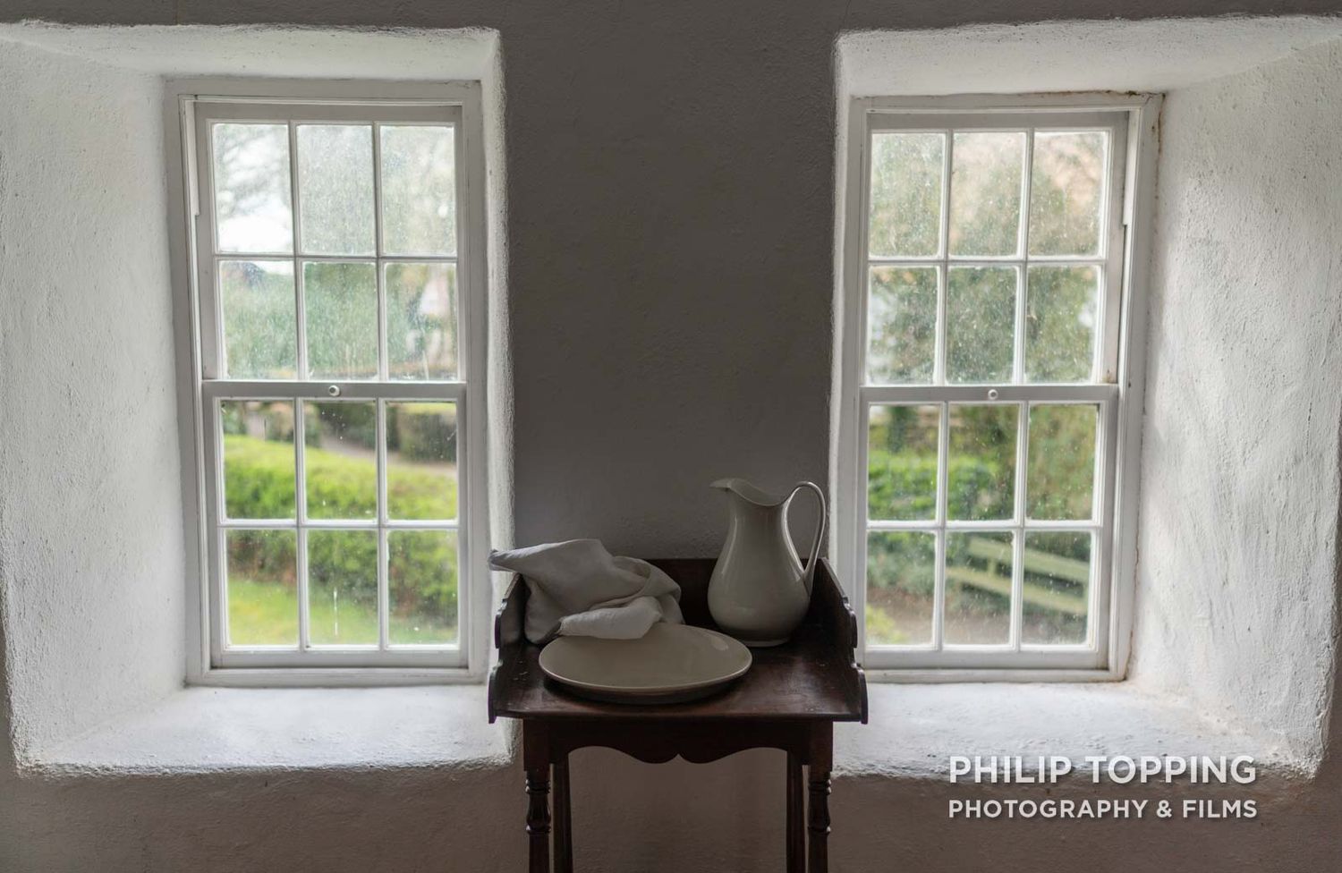 Two windows with a table in the middle.