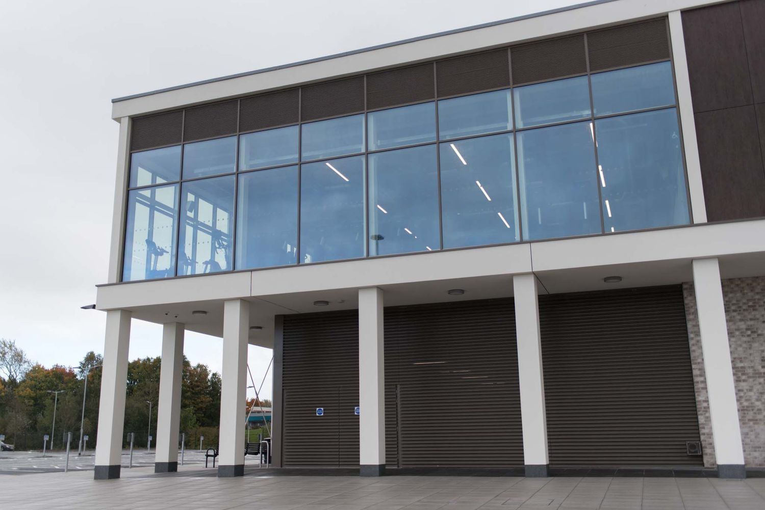 Outside of South Lake Leisure Centre, there are large windows where the gym is located.