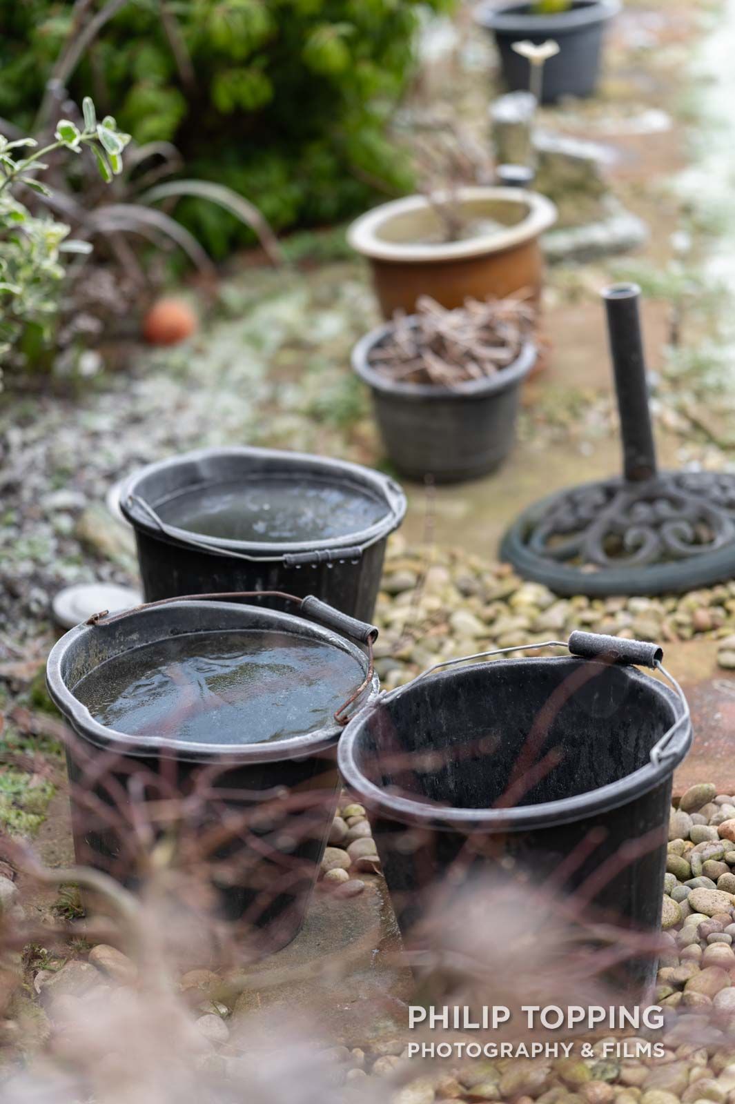 Buckets with frozen water showed how cold the weather was.
