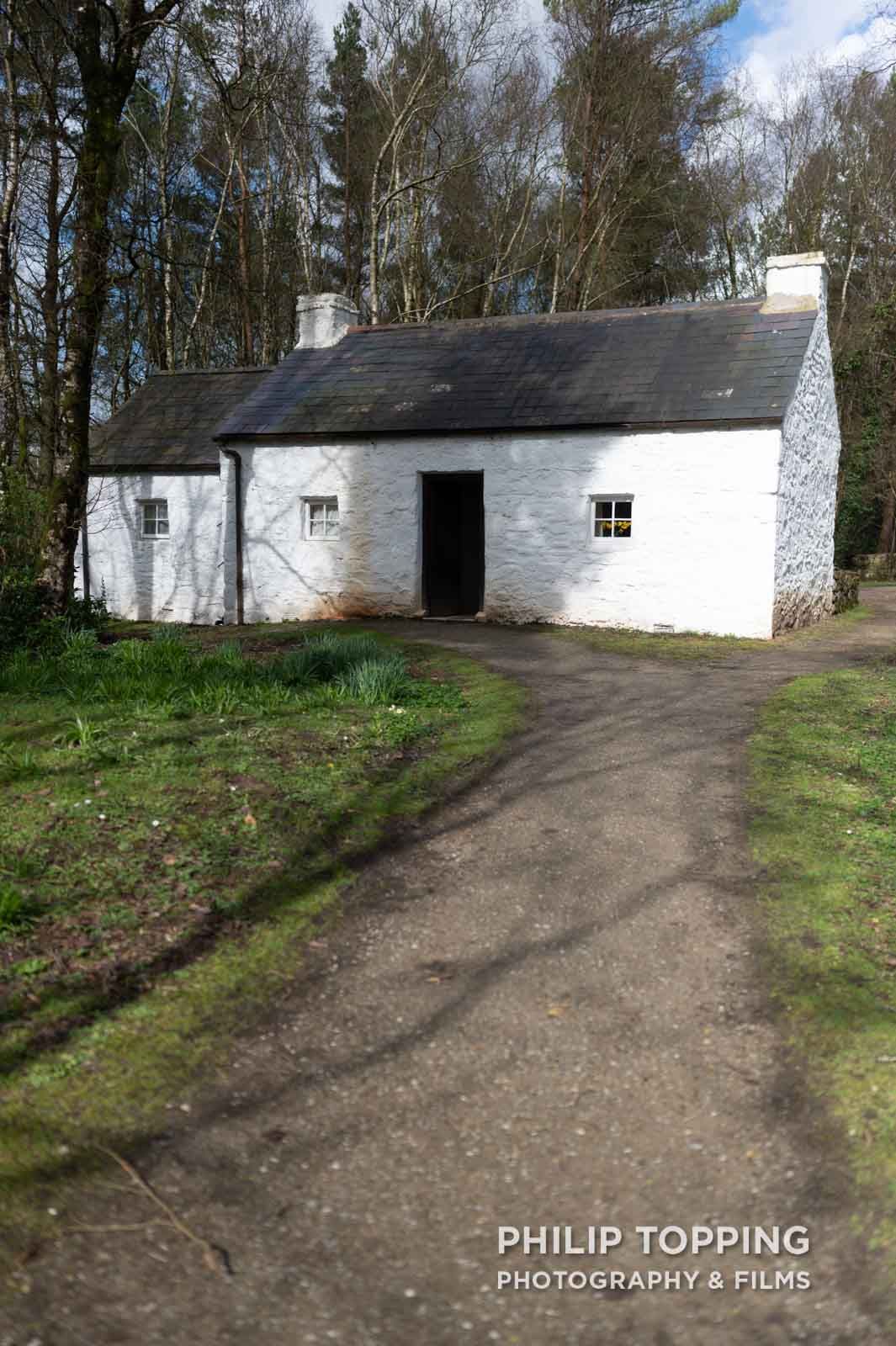 Path leading up to the white cottage.